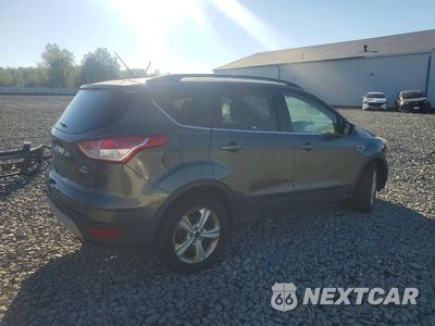 Trzecie zdjęcie samochodu z tyłu: 2016 FORD ESCAPE SE VIN:1FMCU9GX5GUB85587 - miniatura