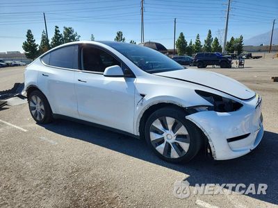 Czwarte zdjęcie samochodu z boku: 2022 TESLA MODEL Y VIN:7SAYGDEE6NF445848 - miniatura