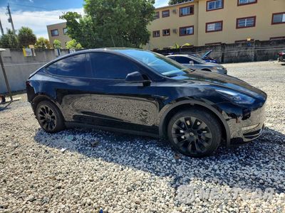 Czwarte zdjęcie samochodu z boku: 2024 TESLA MODEL Y VIN:7SAYGDED3RF092465 - miniatura