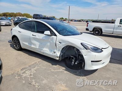 Czwarte zdjęcie samochodu z boku: 2023 TESLA MODEL 3 VIN:5YJ3E1EA7PF402597 - miniatura