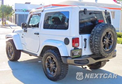 Czwarte zdjęcie samochodu z boku: 2016 JEEP WRANGLER SAHARA VIN:1C4AJWBG4GL259419 - miniatura