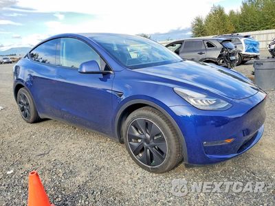 Czwarte zdjęcie samochodu z boku: 2023 TESLA MODEL Y VIN:7SAYGAEE2PF602129 - miniatura