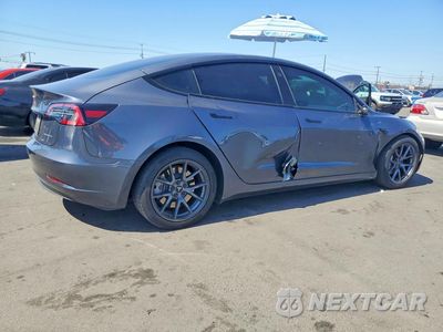 Trzecie zdjęcie samochodu z tyłu: 2023 TESLA MODEL 3 VIN:5YJ3E1EB1PF390326 - miniatura