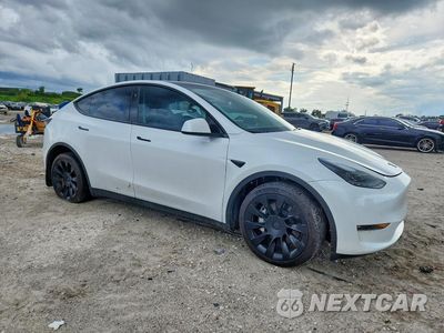 Czwarte zdjęcie samochodu z boku: 2023 TESLA MODEL Y VIN:7SAYGDEE6PF854161 - miniatura