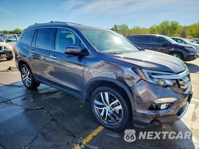 Czwarte zdjęcie samochodu z boku: 2018 HONDA PILOT TOURING VIN:5FNYF6H92JB034564 - miniatura