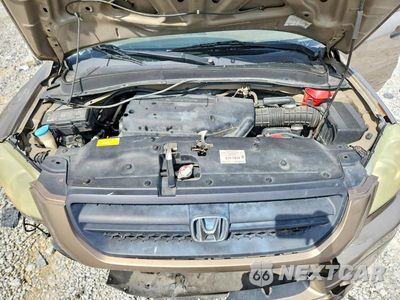 Zdjęcie 12 z 13 samochodu: 2004 HONDA PILOT EXL VIN:2HKYF18664H508482 - miniatura