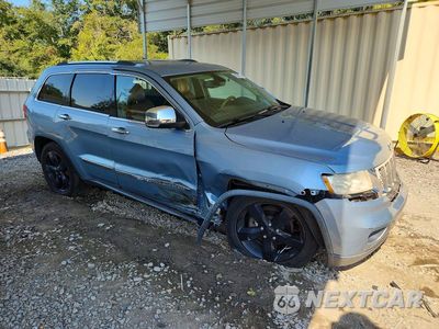 Czwarte zdjęcie samochodu z boku: 2013 JEEP GRAND CHEROKEE OVERLAND VIN:1C4RJECG4DC612796 - miniatura