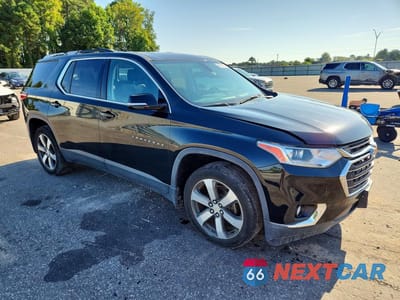Czwarte zdjęcie samochodu z boku: 2018 CHEVROLET TRAVERSE LT VIN:1GNERHKW0JJ104874 - miniatura