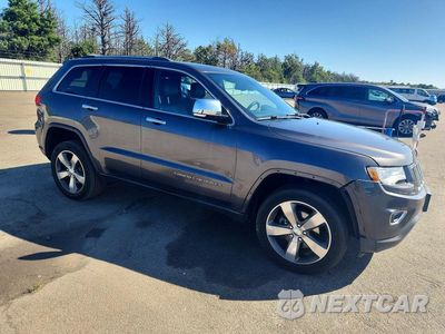 Czwarte zdjęcie samochodu z boku: 2015 JEEP GRAND CHEROKEE LIMITED VIN:1C4RJFBG2FC602357 - miniatura
