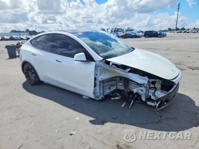 Czwarte zdjęcie samochodu z boku: 2023 TESLA MODEL Y VIN:7SAYGDEF7PF754353 - miniatura