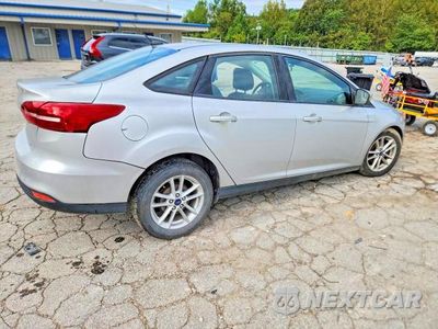 Trzecie zdjęcie samochodu z tyłu: 2017 FORD FOCUS SE VIN:1FADP3F27HL204267 - miniatura