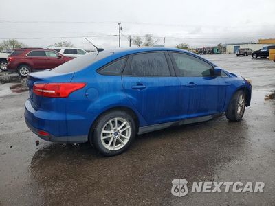 Trzecie zdjęcie samochodu z tyłu: 2018 FORD FOCUS SE VIN:1FADP3F24JL212946 - miniatura