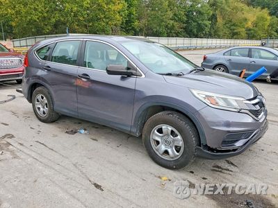 Czwarte zdjęcie samochodu z boku: 2015 HONDA CR-V LX VIN:2HKRM4H30FH605035 - miniatura