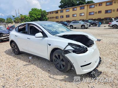 Czwarte zdjęcie samochodu z boku: 2022 TESLA MODEL Y VIN:7SAYGDEE5NF356840 - miniatura