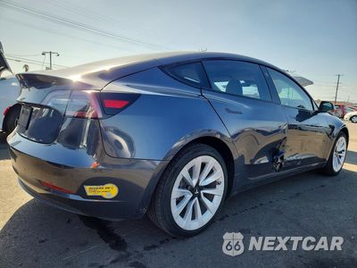 Trzecie zdjęcie samochodu z tyłu: 2022 TESLA MODEL 3 VIN:5YJ3E1EA0NF324886 - miniatura