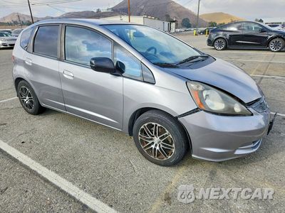 Czwarte zdjęcie samochodu z boku: 2010 HONDA FIT VIN:JHMGE8H20AS007409 - miniatura