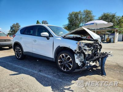 Czwarte zdjęcie samochodu z boku: 2016 MAZDA CX-5 GT VIN:JM3KE4DY2G0814122 - miniatura