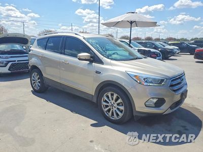Czwarte zdjęcie samochodu z boku: 2017 FORD ESCAPE TITANIUM VIN:1FMCU0J95HUC95014 - miniatura