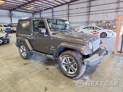Czwarte zdjęcie samochodu z boku: 2016 JEEP WRANGLER SAHARA VIN:1C4AJWBG0GL167580 - miniatura