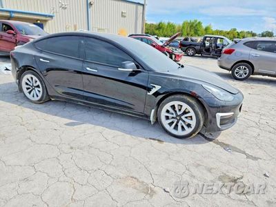Czwarte zdjęcie samochodu z boku: 2023 TESLA MODEL 3 VIN:5YJ3E1EA0PF492935 - miniatura