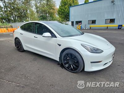 Czwarte zdjęcie samochodu z boku: 2022 TESLA MODEL 3 VIN:5YJ3E1EB3NF318735 - miniatura