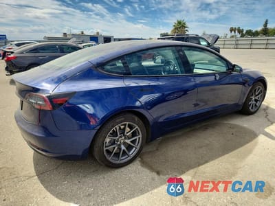 Trzecie zdjęcie samochodu z tyłu: 2022 TESLA MODEL 3 VIN:5YJ3E1EA5NF288869 - miniatura