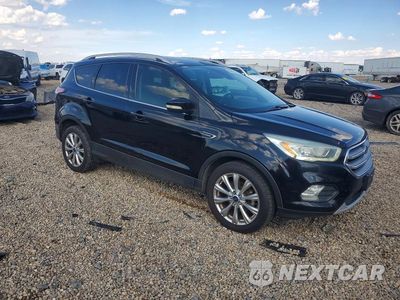 Czwarte zdjęcie samochodu z boku: 2017 FORD ESCAPE TITANIUM VIN:1FMCU0JD8HUA93238 - miniatura
