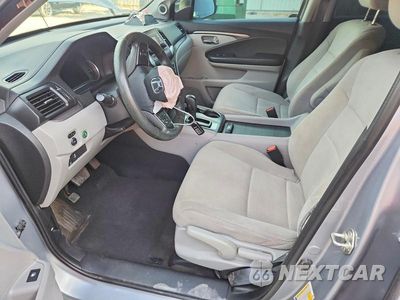 Zdjęcie 7 z 14 samochodu: 2020 HONDA PILOT LX VIN:5FNYF5H11LB002874 - miniatura