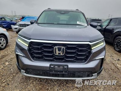 Piąte zdjęcie samochodu w środku: 2025 HONDA PILOT TOURING VIN:5FNYG1H72SB145647 - miniatura