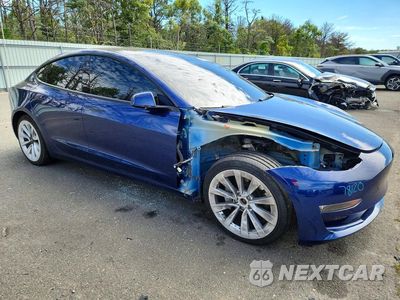 Czwarte zdjęcie samochodu z boku: 2022 TESLA MODEL 3 VIN:5YJ3E1EB1NF142834 - miniatura