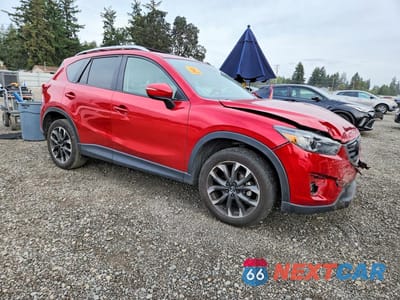 Czwarte zdjęcie samochodu z boku: 2016 MAZDA CX-5 GT VIN:JM3KE4DY1G0676699 - miniatura