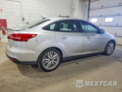 Trzecie zdjęcie samochodu z tyłu: 2015 FORD FOCUS TITANIUM VIN:1FADP3J22FL387131 - miniatura