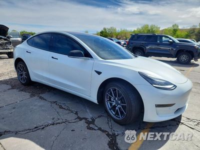 Czwarte zdjęcie samochodu z boku: 2018 TESLA MODEL 3 VIN:5YJ3E1EB9JF134829 - miniatura