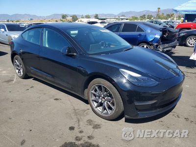 Czwarte zdjęcie samochodu z boku: 2022 TESLA MODEL 3 VIN:5YJ3E1EA1NF189451 - miniatura