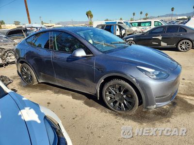 Czwarte zdjęcie samochodu z boku: 2023 TESLA MODEL Y VIN:7SAYGAEE9PF713860 - miniatura
