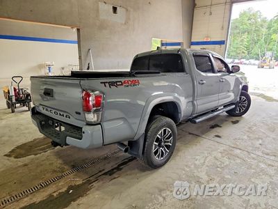 Trzecie zdjęcie samochodu z tyłu: 2020 TOYOTA TACOMA TRD SPORT VIN:3TMDZ5BN6LM094786 - miniatura