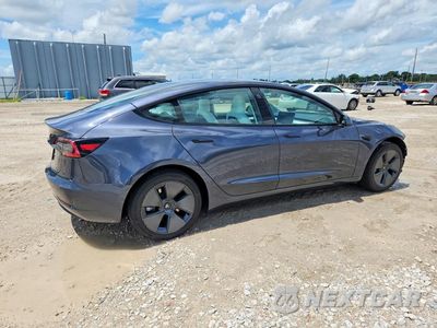 Trzecie zdjęcie samochodu z tyłu: 2023 TESLA MODEL 3 VIN:5YJ3E1EA9PF673287 - miniatura