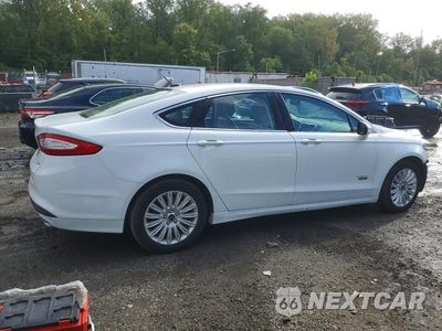 Trzecie zdjęcie samochodu z tyłu: 2014 FORD FUSION SE PHEV VIN:3FA6P0PU1ER397679 - miniatura
