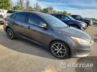 Czwarte zdjęcie samochodu z boku: 2017 FORD FOCUS S VIN:1FADP3E21HL261940 - miniatura