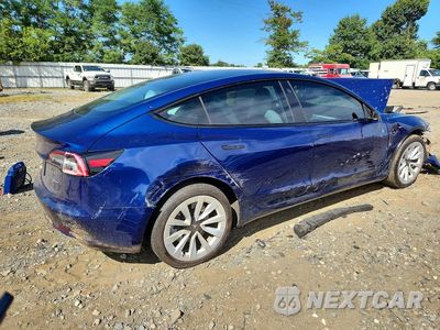 Trzecie zdjęcie samochodu z tyłu: 2023 TESLA MODEL 3 VIN:5YJ3E1EA8PF552377 - miniatura