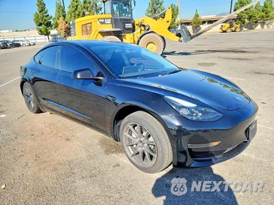 Czwarte zdjęcie samochodu z boku: 2023 TESLA MODEL 3 VIN:5YJ3E1EB1PF663023 - miniatura