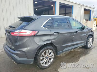 Trzecie zdjęcie samochodu z tyłu: 2019 FORD EDGE TITANIUM VIN:2FMPK4K95KBC37155 - miniatura