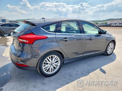 Trzecie zdjęcie samochodu z tyłu: 2017 FORD FOCUS TITANIUM VIN:1FADP3N26HL349219 - miniatura