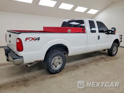 Trzecie zdjęcie samochodu z tyłu: 2014 FORD F250 SUPER DUTY VIN:1FT7X2B65EEA55528 - miniatura