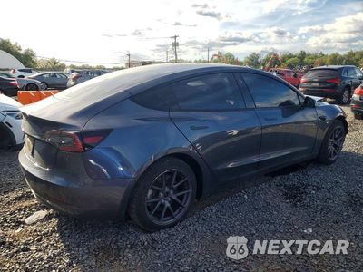 Trzecie zdjęcie samochodu z tyłu: 2023 TESLA MODEL 3 VIN:5YJ3E1EA7PF676527 - miniatura