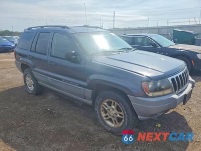 Czwarte zdjęcie samochodu z boku: 2002 JEEP GRAND CHEROKEE LAREDO VIN:1J4GW48S72C227739 - miniatura