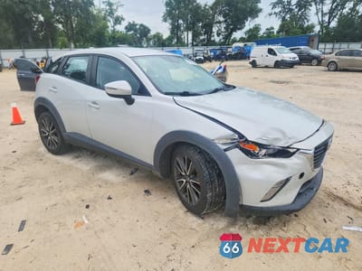 Czwarte zdjęcie samochodu z boku: 2017 MAZDA CX-3 TOURING VIN:JM1DKDC71H0179480 - miniatura