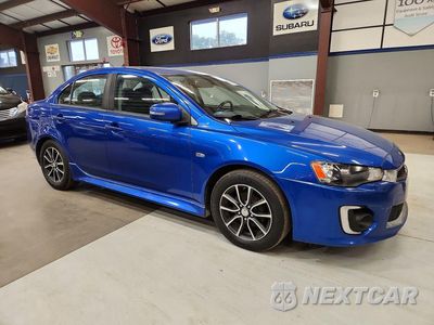 Czwarte zdjęcie samochodu z boku: 2017 MITSUBISHI LANCER ES VIN:JA32V2FW2HU001915 - miniatura