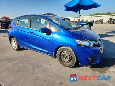 Czwarte zdjęcie samochodu z boku: 2015 HONDA FIT LX VIN:3HGGK5H51FM718637 - miniatura