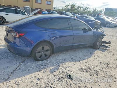Trzecie zdjęcie samochodu z tyłu: 2023 TESLA MODEL 3 VIN:5YJ3E1EA3PF573038 - miniatura